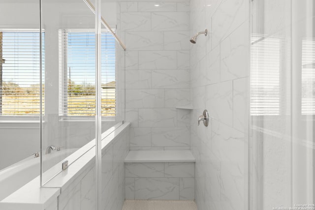 bathroom with tiled shower