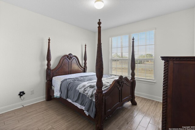 bedroom featuring hardwood / wood-style flooring