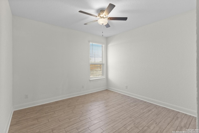 unfurnished room featuring ceiling fan and light hardwood / wood-style floors