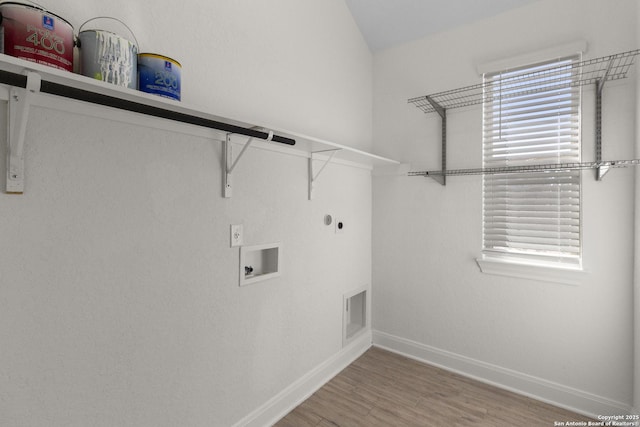 laundry area featuring wood-type flooring, hookup for an electric dryer, hookup for a gas dryer, and hookup for a washing machine