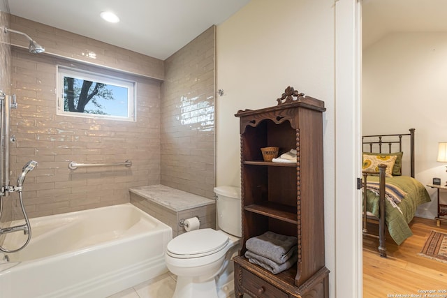 31545 Meadow Crk, Fair Oaks Ranch, TX 78015 - ensuite bathroom with connected bathroom, walk in shower, toilet, wood finished floors, and a bath