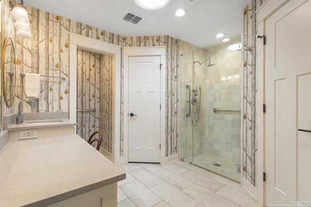 31545 Meadow Crk, Fair Oaks Ranch, TX 78015 - full bath featuring visible vents, tile patterned flooring, vanity, wallpapered walls, and a stall shower