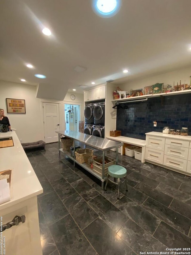 kitchen with light countertops, recessed lighting, white cabinetry, and decorative backsplash