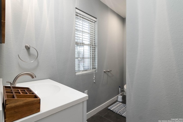 bathroom with tile patterned flooring and vanity