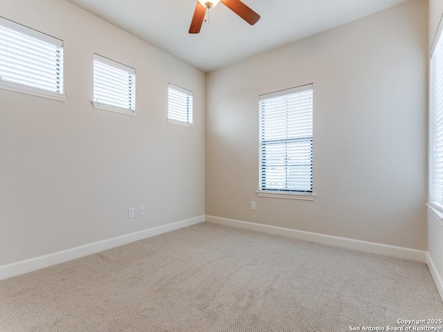 carpeted empty room with ceiling fan