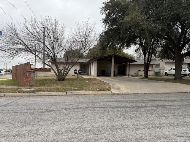 view of front of home with a carport