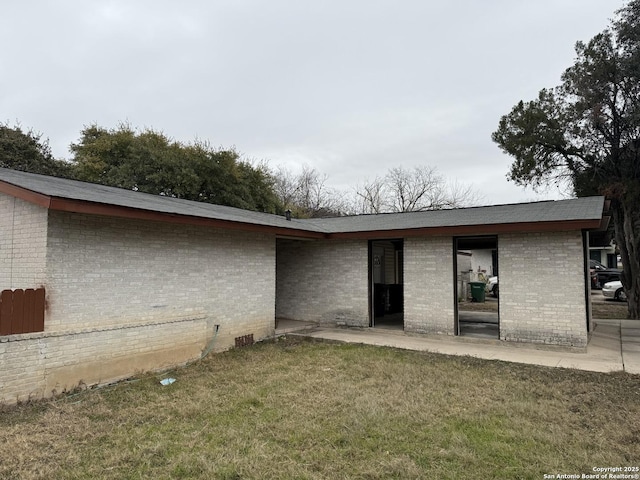 rear view of house with a lawn