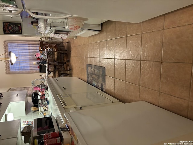 interior space featuring tile walls