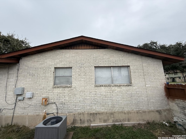 view of side of property featuring central AC unit