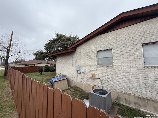 view of side of property featuring central AC unit