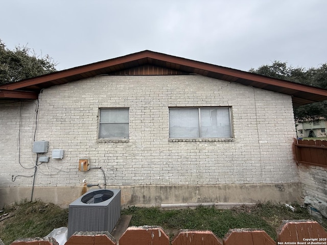 view of side of home featuring central air condition unit