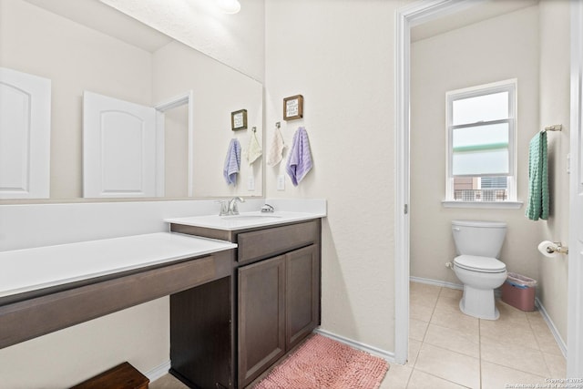 bathroom with vanity, tile patterned floors, and toilet