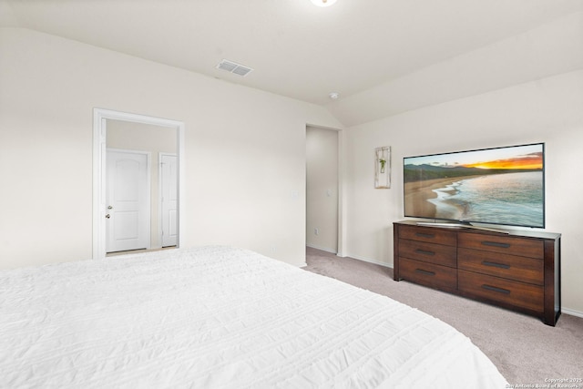 carpeted bedroom featuring vaulted ceiling