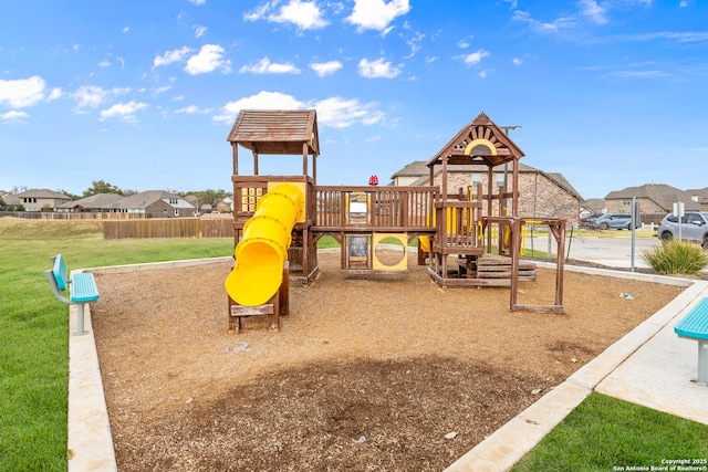 view of jungle gym with a lawn