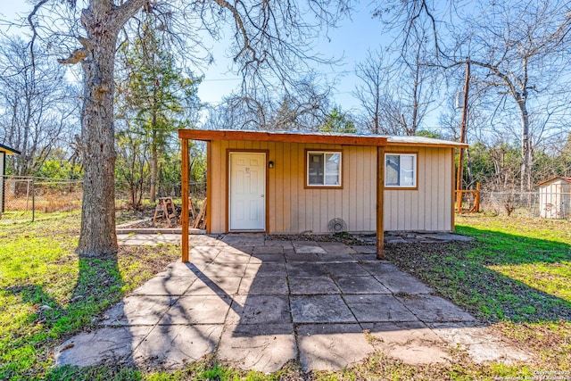 view of outbuilding featuring a yard