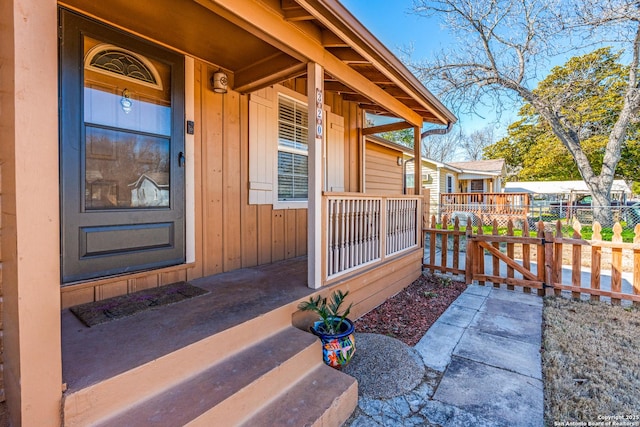 doorway to property featuring covered porch