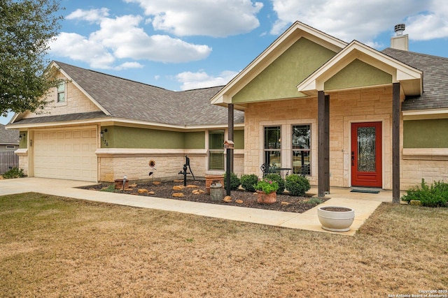 view of front facade featuring a garage and a front lawn