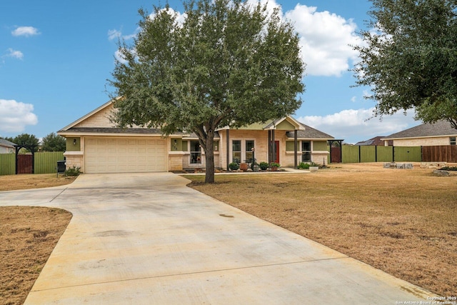 view of front of home with a garage and a front yard