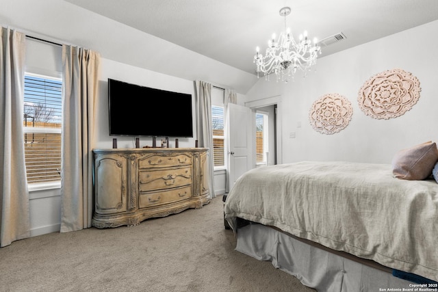 carpeted bedroom featuring lofted ceiling and a chandelier