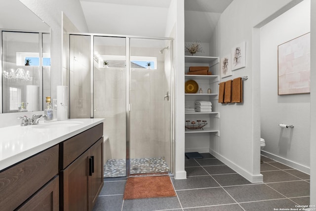 bathroom with tile patterned flooring, vanity, an enclosed shower, toilet, and a healthy amount of sunlight