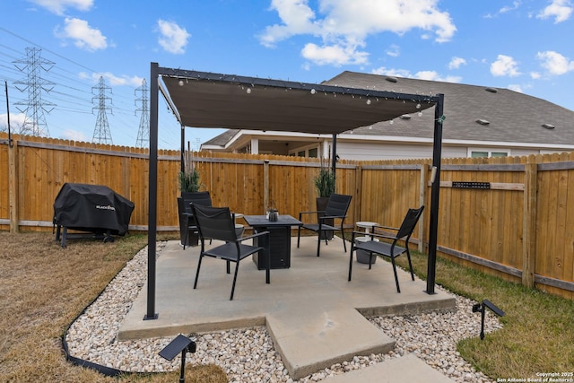 view of patio with a grill and a fire pit