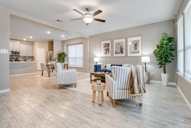 living room featuring ceiling fan