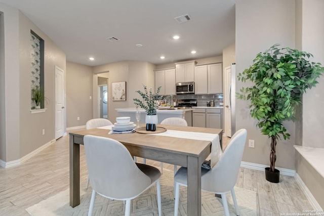 dining room featuring light hardwood / wood-style flooring