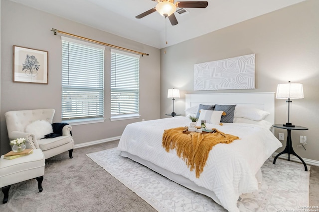 bedroom with light carpet, lofted ceiling, and ceiling fan