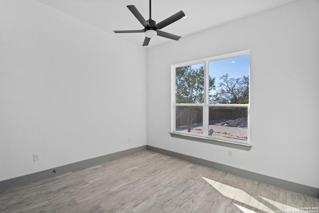 unfurnished room featuring ceiling fan and light wood-type flooring