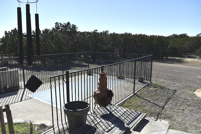 view of patio featuring a swimming pool