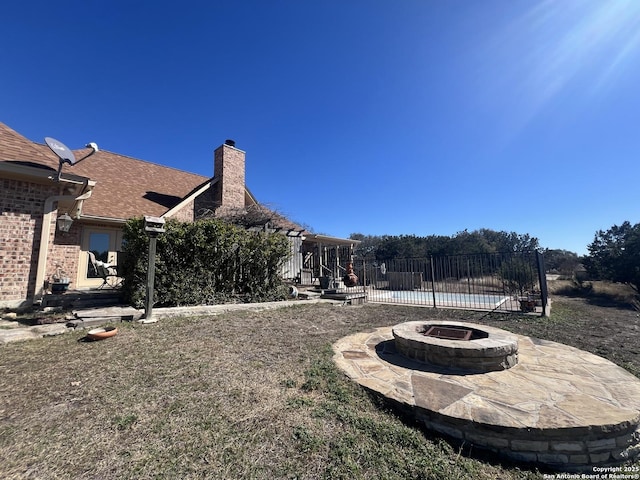 view of yard with a patio area and an outdoor fire pit