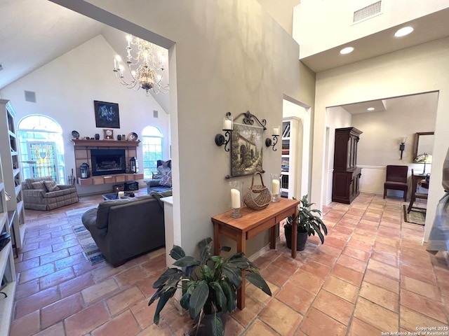 interior space with an inviting chandelier and high vaulted ceiling