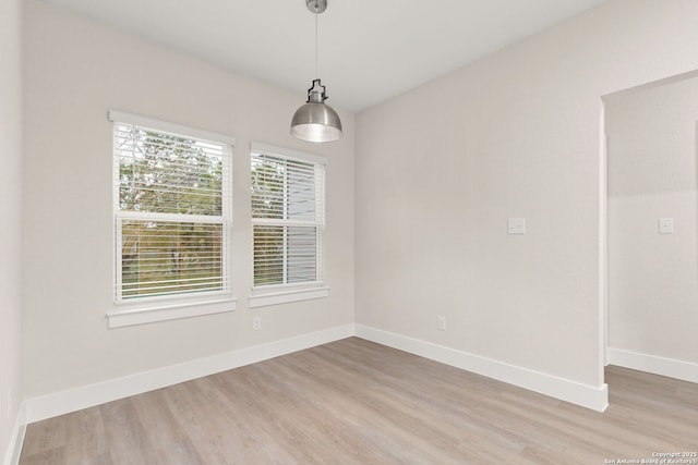 unfurnished dining area featuring light hardwood / wood-style floors