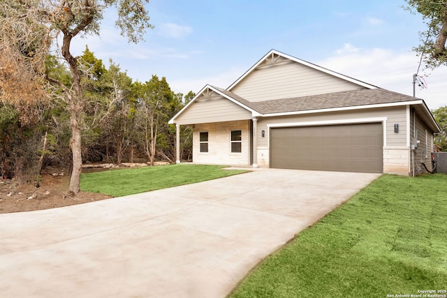 view of front facade with a garage and a front lawn