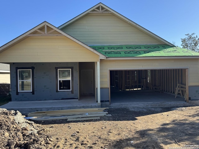 view of front of house featuring a garage and covered porch