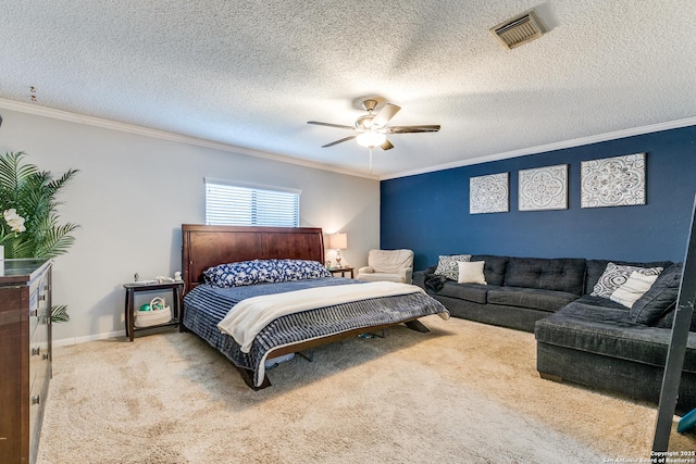 carpeted bedroom featuring a textured ceiling, ornamental molding, and ceiling fan