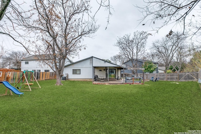 view of yard featuring a patio and a playground