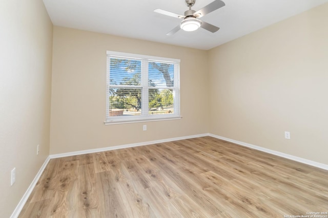 unfurnished room with ceiling fan and light hardwood / wood-style floors