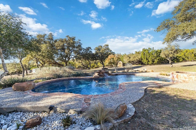 view of pool with pool water feature