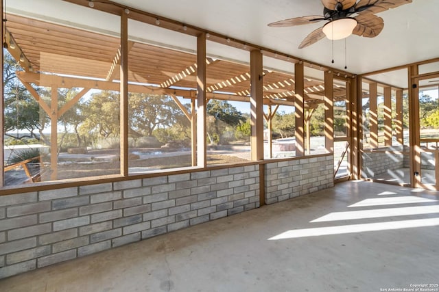 view of patio / terrace with ceiling fan and a pergola