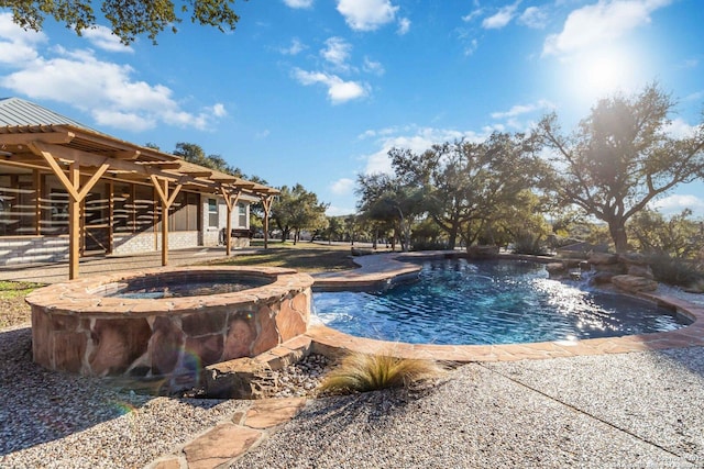 view of pool featuring an in ground hot tub