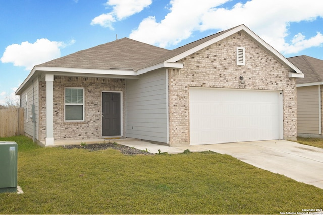 single story home featuring a garage and a front yard