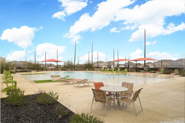 view of swimming pool with a patio