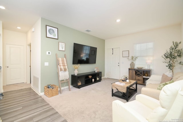 living room featuring light colored carpet