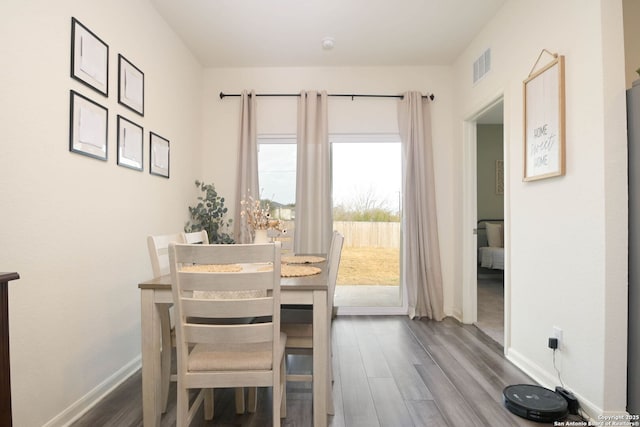 dining area featuring hardwood / wood-style floors