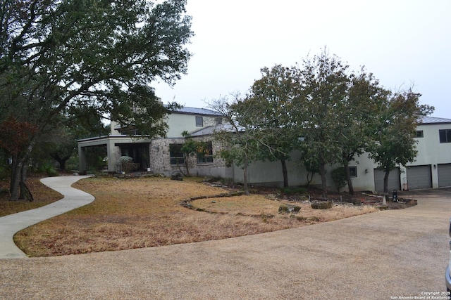 view of side of home featuring a garage