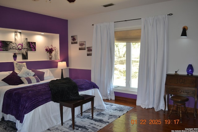 bedroom with wood-type flooring