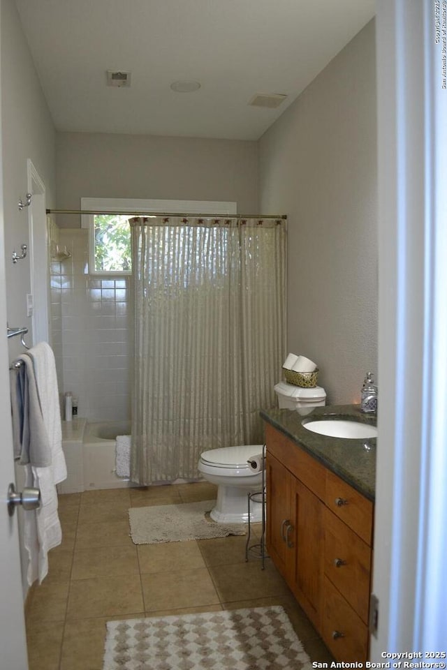 full bathroom with shower / tub combo with curtain, vanity, tile patterned flooring, and toilet