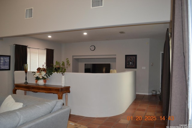 hall with tile patterned flooring