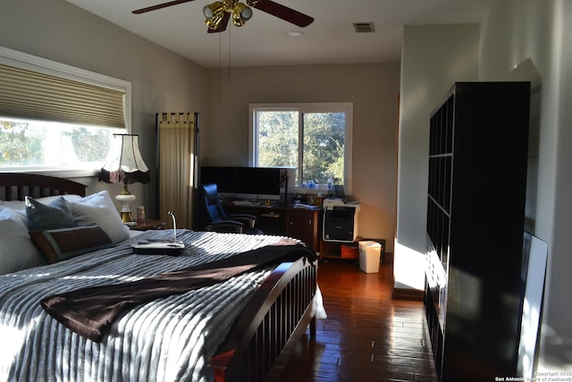 bedroom featuring dark wood-type flooring and ceiling fan